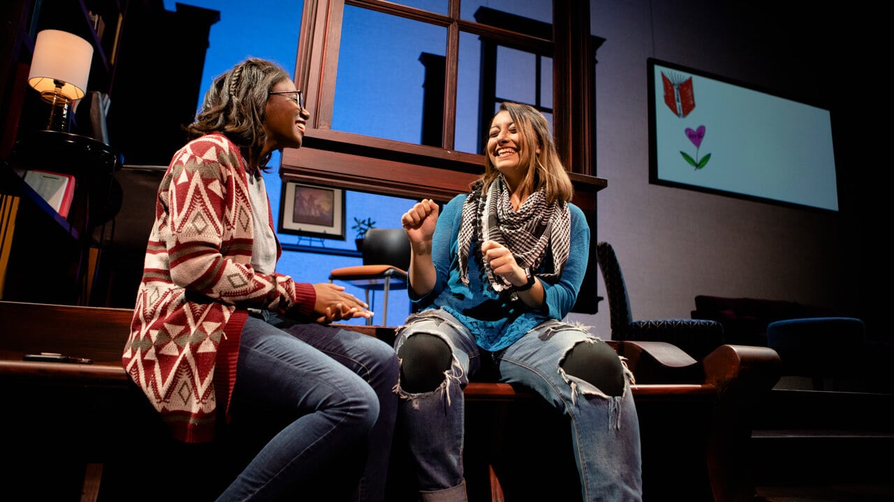 2 female student actors on stage for the production, Baltimore
