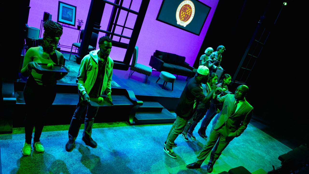 A group of student actors on stage for the production, Baltimore