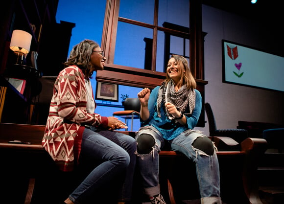 2 female student actors on stage for the production, Baltimore