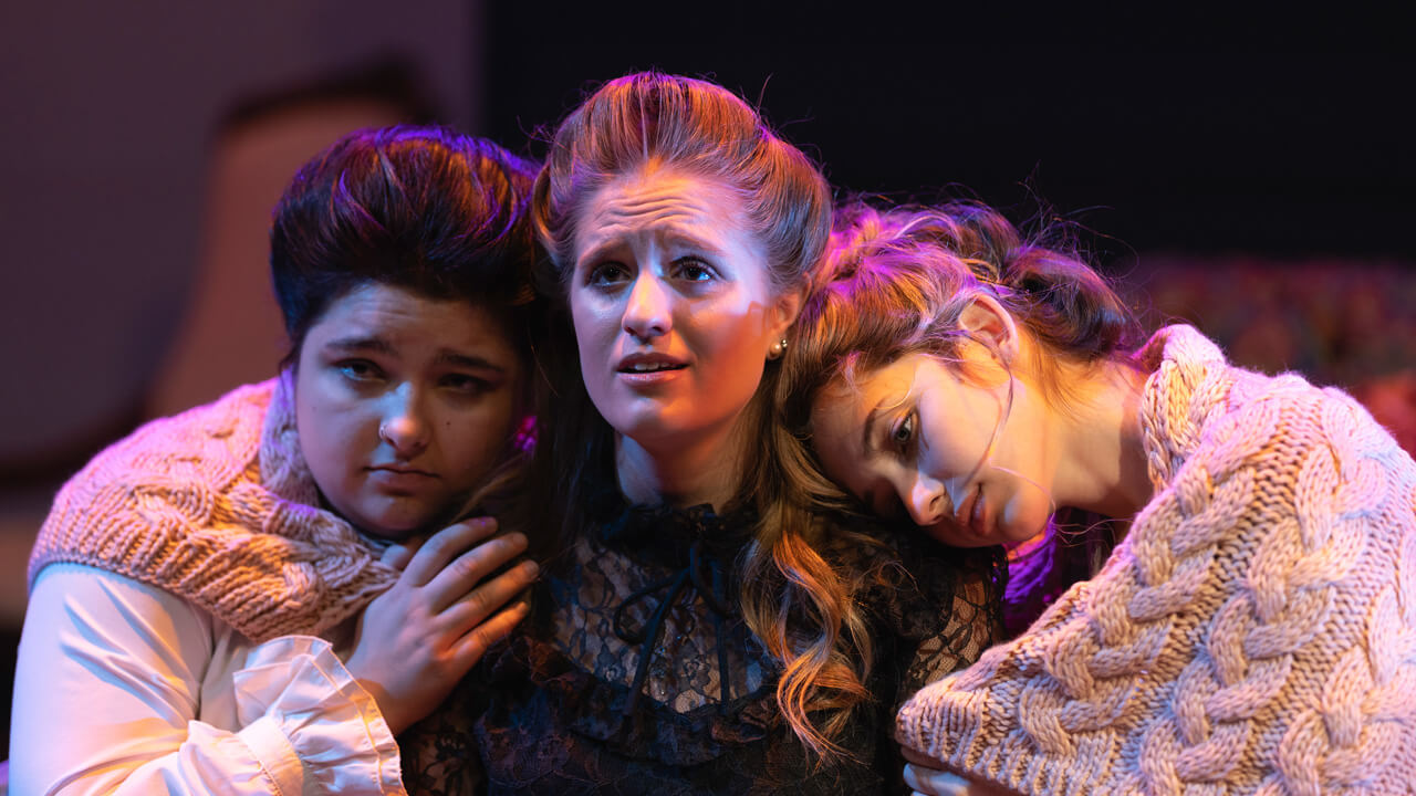 Three female student actors on stage for the production, Three Sisters