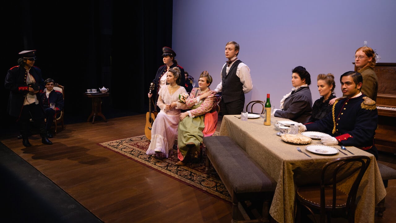 A group of student actors on stage for the production, Three Sisters